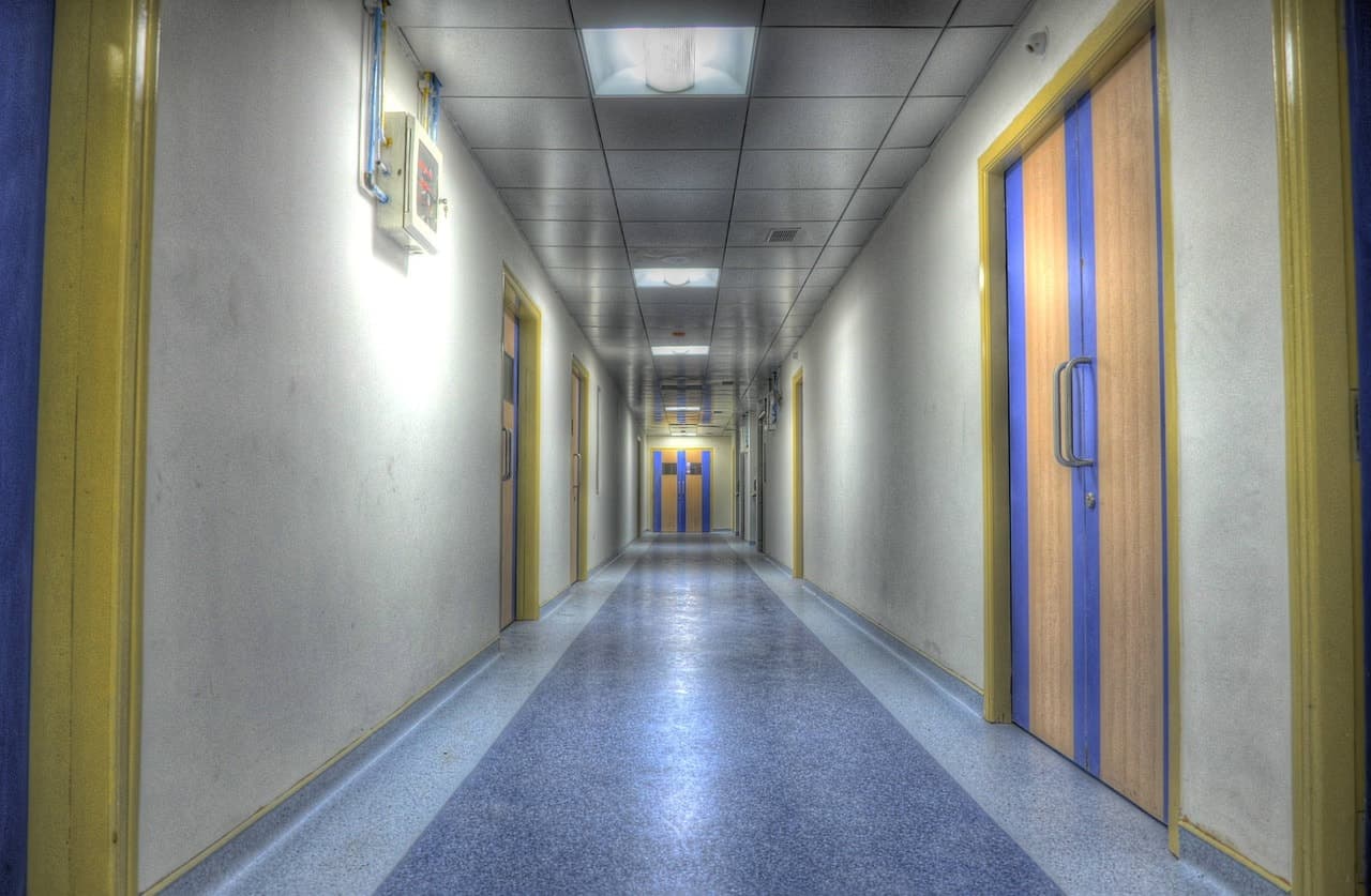Hospital corridor with doors on both sides
