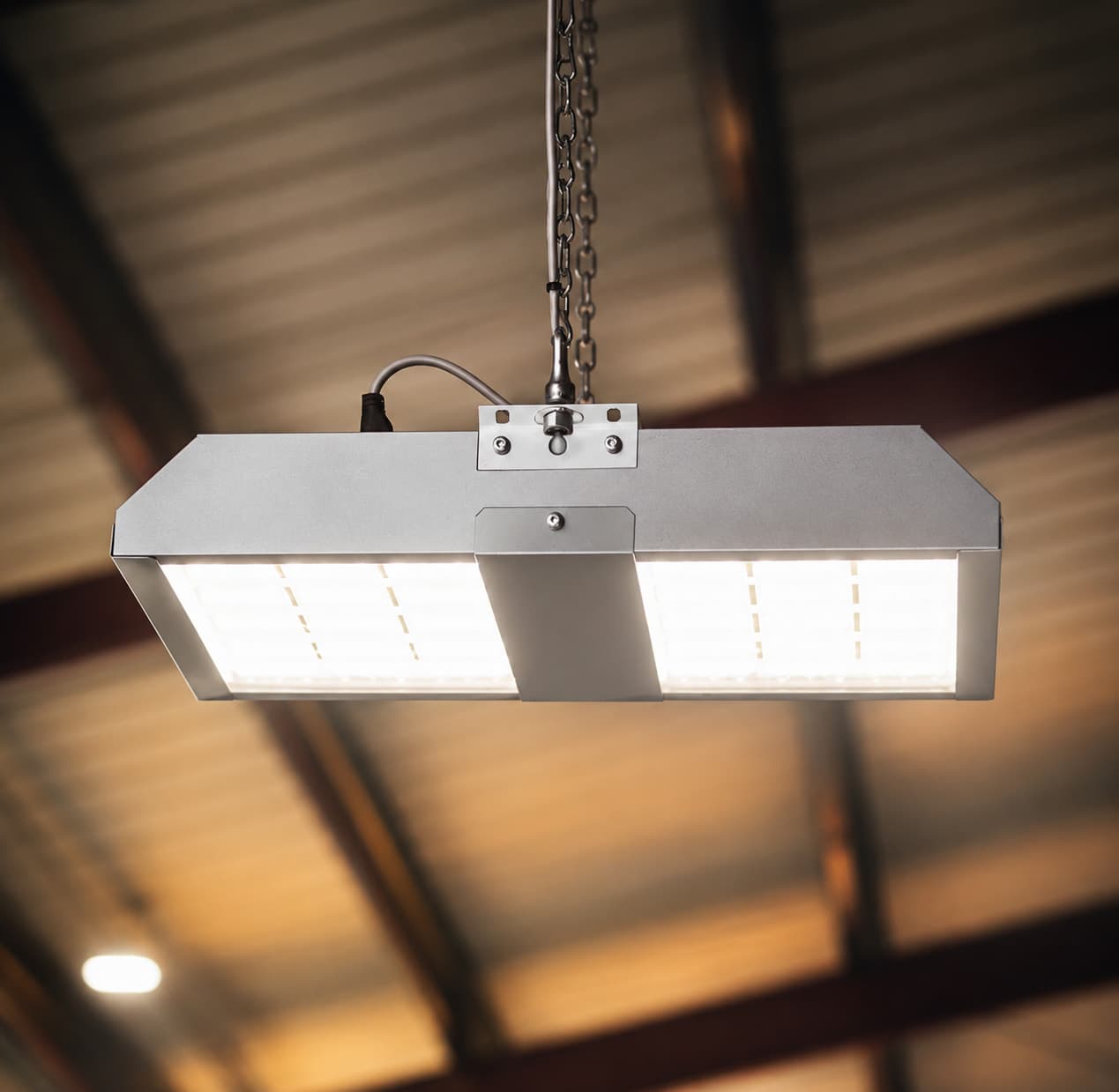 High-bay LED fixture installed in an industrial ceiling